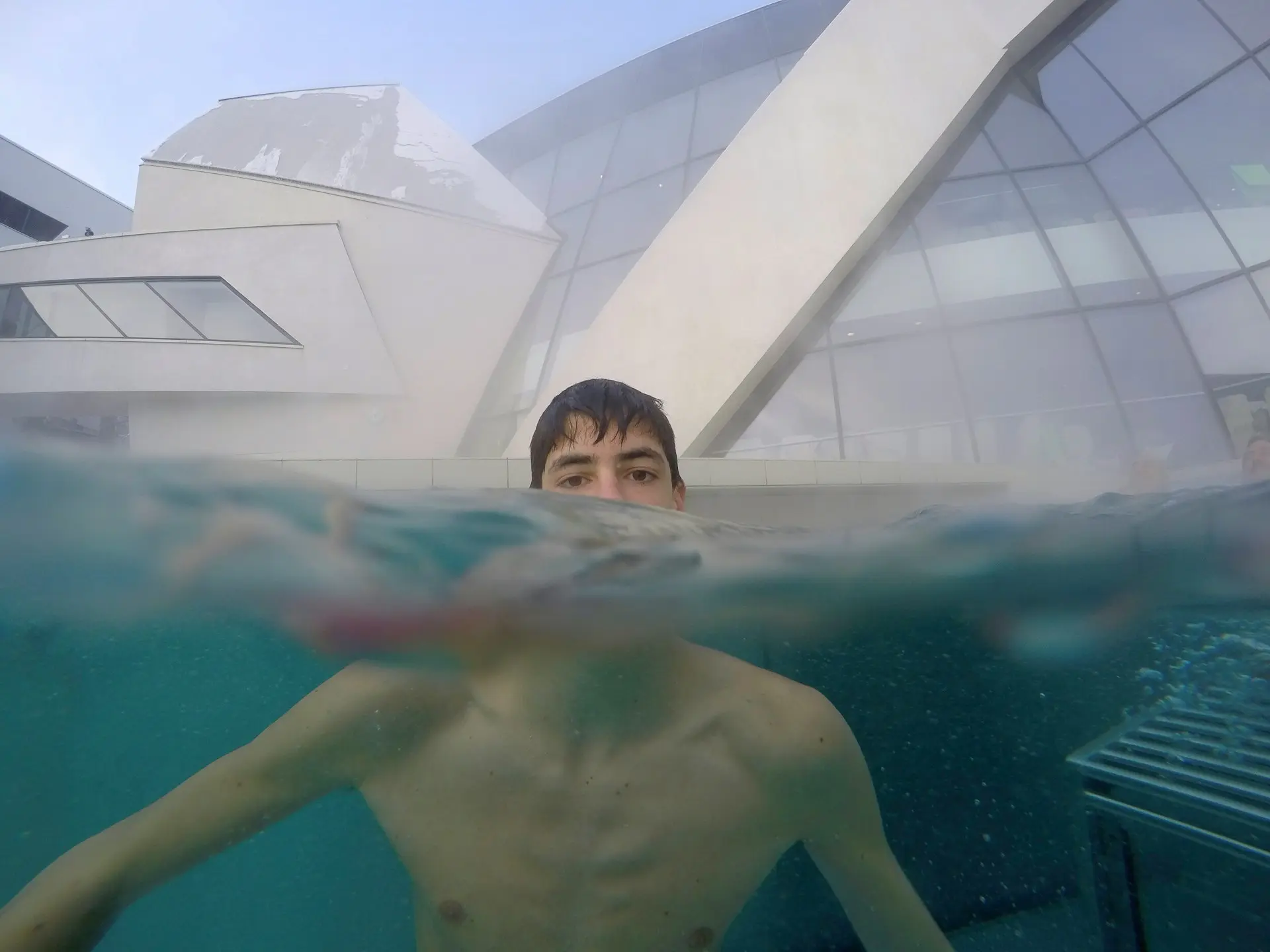 topless boy in swimming pool